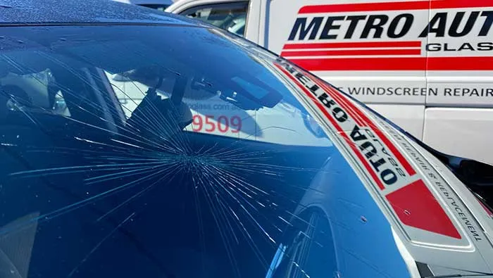 A cracked windscreen on a vehicle awaiting replacement