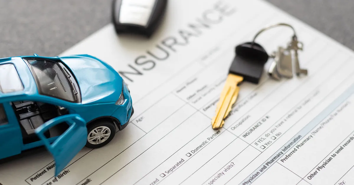 Paperwork being completed for a windscreen insurance claim