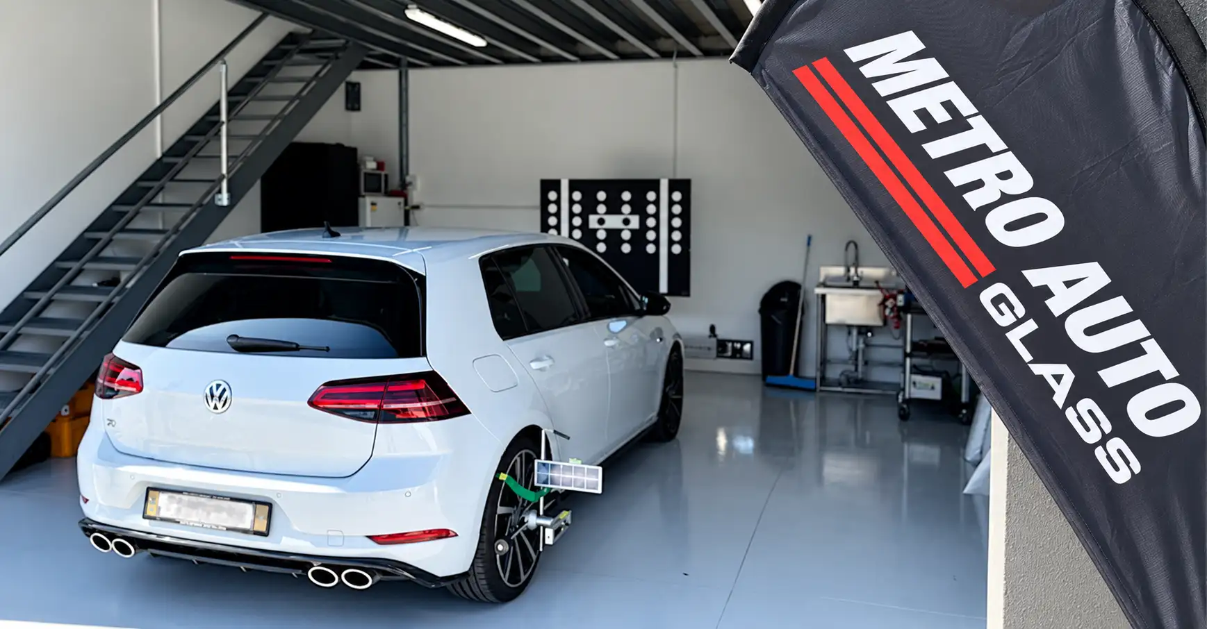 ADAS calibration target board set up behind a vehicle in the Metro Auto Glass workshop